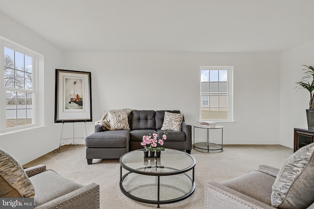 carpeted living room featuring a healthy amount of sunlight