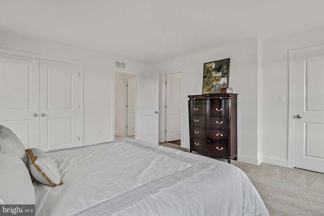 carpeted bedroom featuring a closet