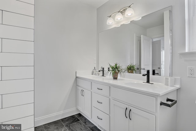 bathroom featuring double vanity and tile floors