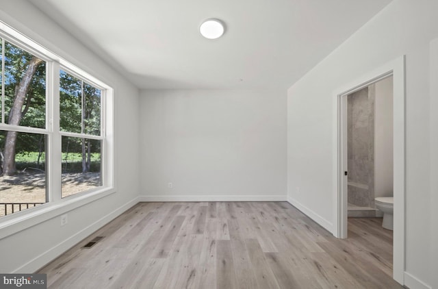 empty room with light wood-type flooring