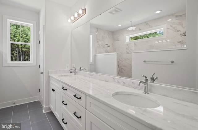 bathroom featuring dual bowl vanity and tile floors