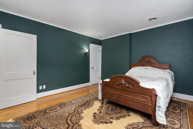 bedroom featuring light hardwood / wood-style flooring