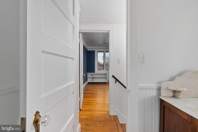 corridor with light wood-type flooring