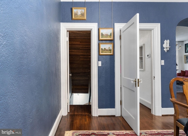 corridor with dark wood-type flooring