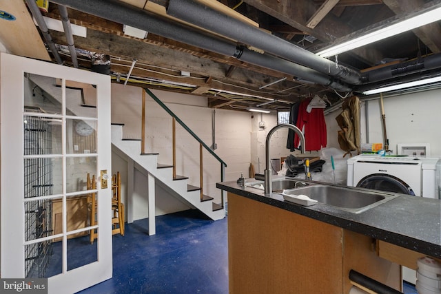 basement with washer / clothes dryer and sink