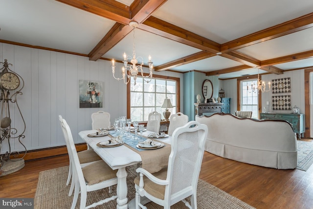 dining room with beamed ceiling, an inviting chandelier, and dark wood-type flooring