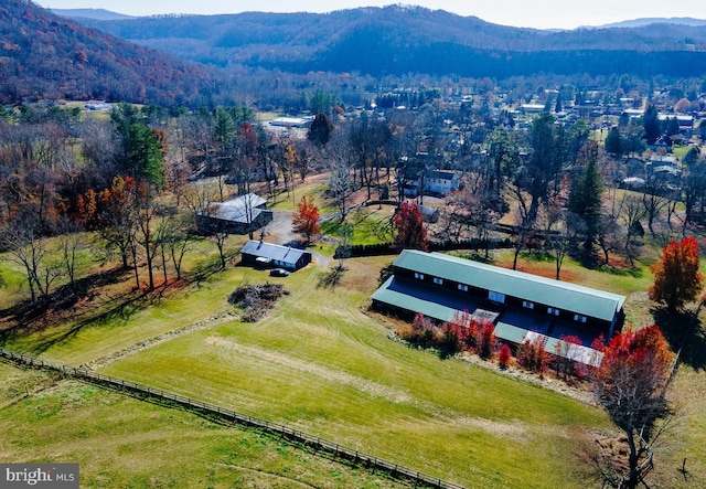 birds eye view of property featuring a mountain view and a rural view