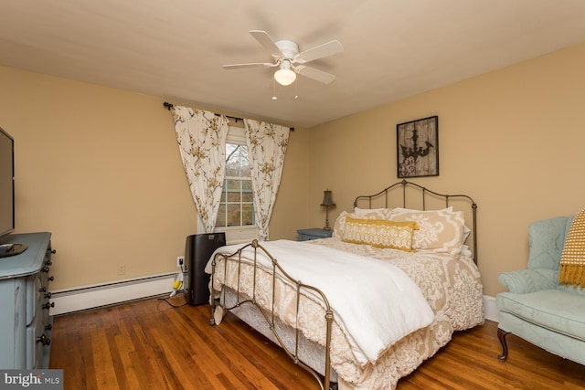 bedroom with ceiling fan, dark wood-type flooring, and a baseboard radiator