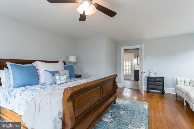 bedroom with ceiling fan and wood-type flooring