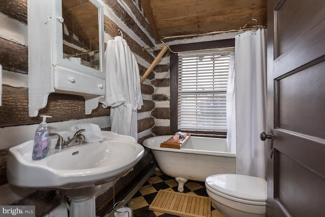 full bathroom featuring sink, independent shower and bath, and toilet