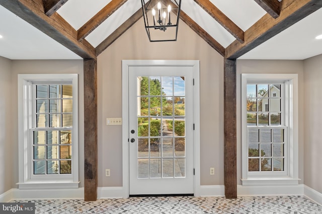 doorway featuring lofted ceiling with beams, carpet, and an inviting chandelier