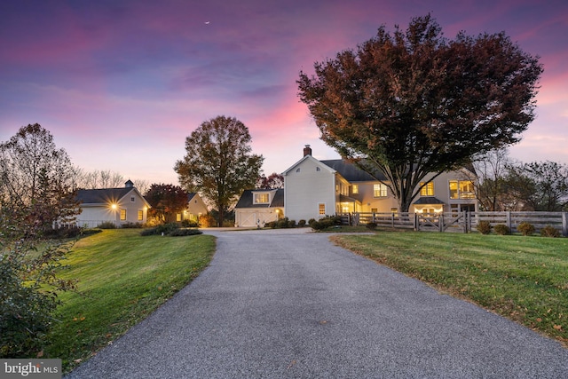 view of front of home featuring a lawn