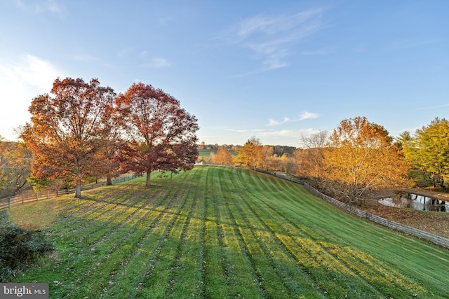 view of yard with a rural view