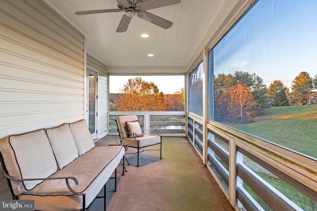 sunroom featuring ceiling fan