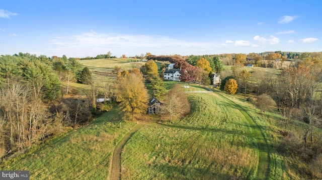 birds eye view of property featuring a rural view