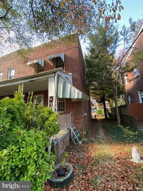 view of property exterior with covered porch