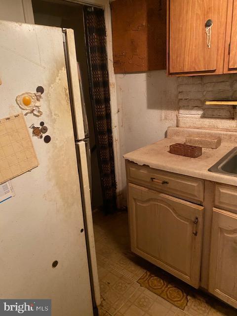 interior space featuring white fridge