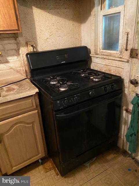 kitchen with black gas stove