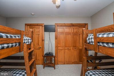 carpeted bedroom with ceiling fan