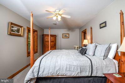 bedroom featuring carpet flooring and ceiling fan