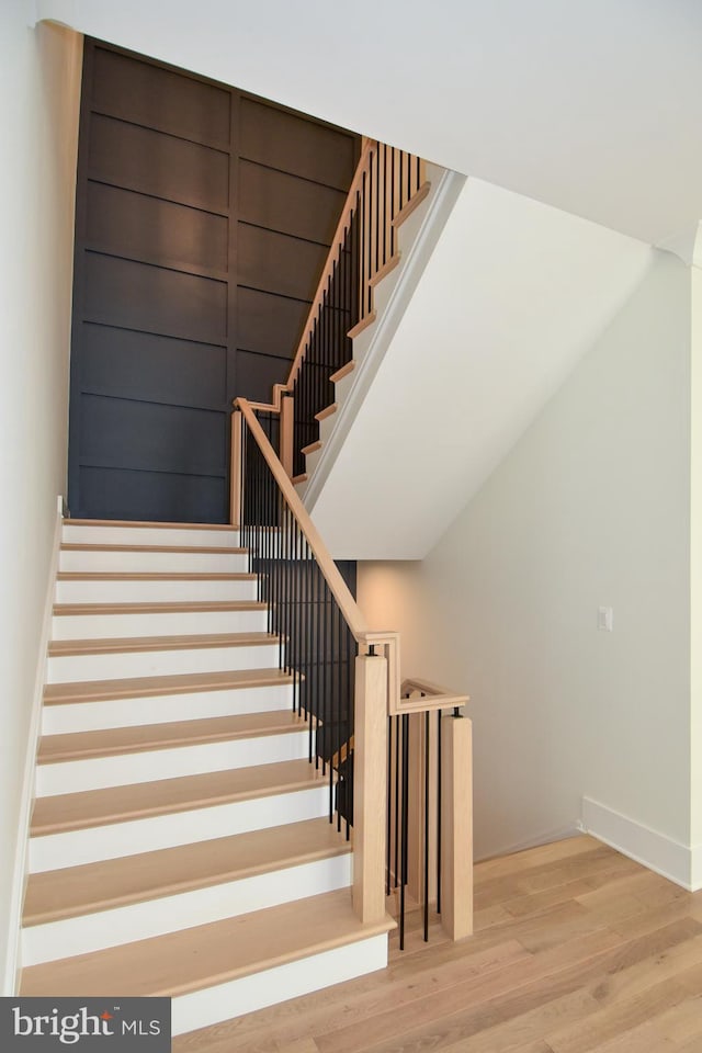 stairway featuring hardwood / wood-style floors