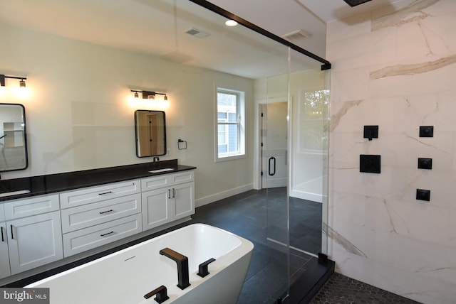 bathroom featuring tile patterned flooring, vanity, and separate shower and tub