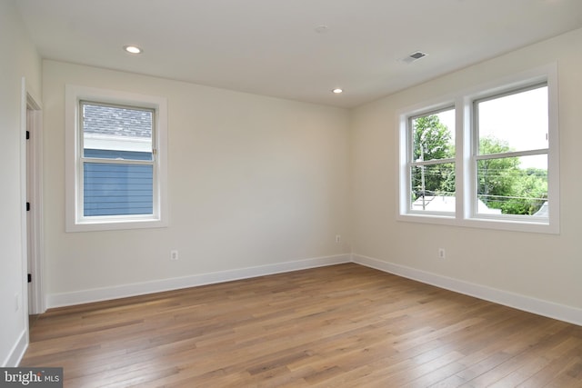 unfurnished room with light hardwood / wood-style flooring