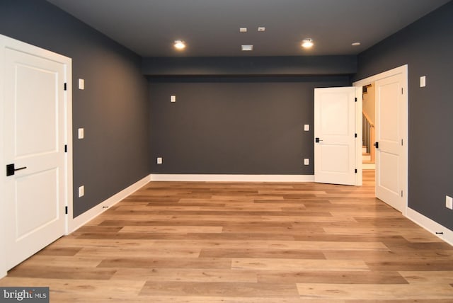 spare room featuring light hardwood / wood-style floors