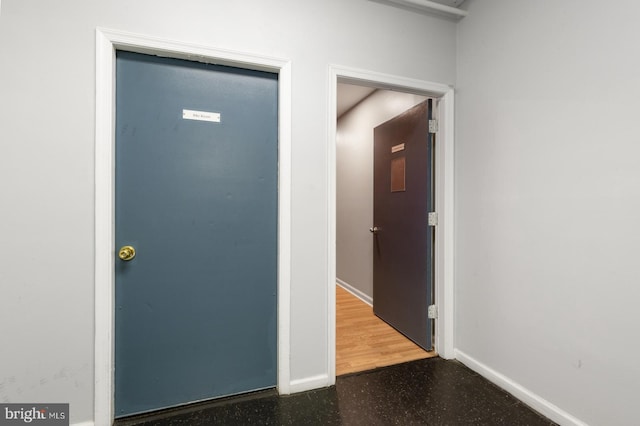 hallway featuring hardwood / wood-style flooring