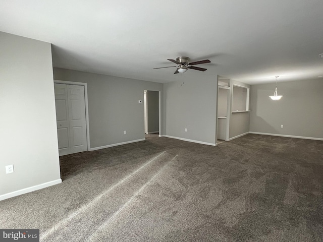 carpeted empty room featuring ceiling fan