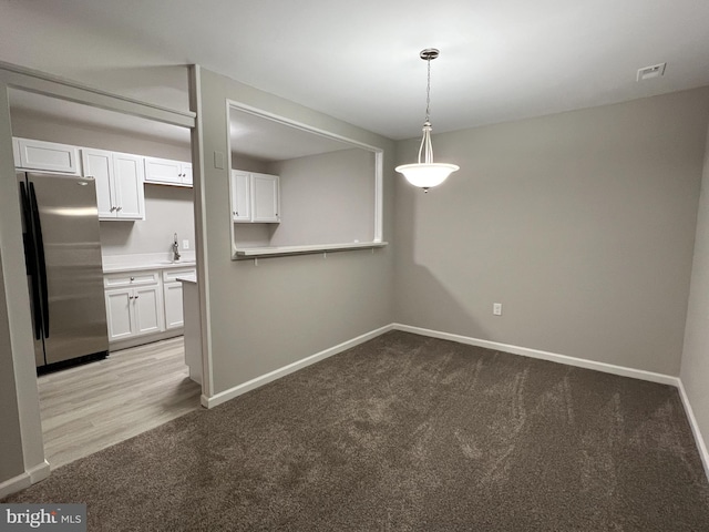 interior space featuring light hardwood / wood-style flooring and sink