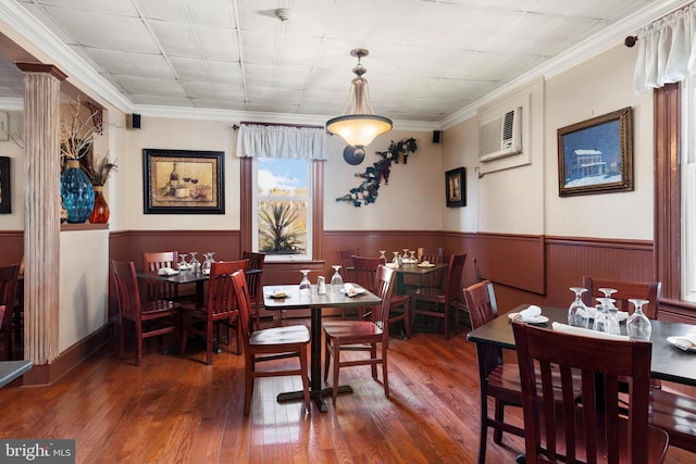 dining area with crown molding, a wall mounted AC, and dark wood-type flooring