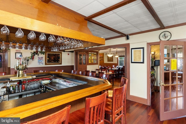 recreation room with dark hardwood / wood-style flooring and indoor bar