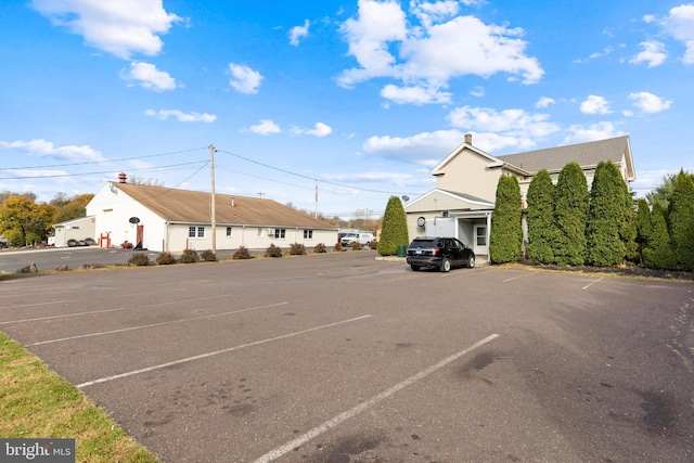 view of car parking featuring a garage