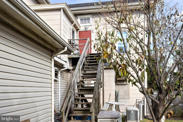 view of side of property featuring central air condition unit