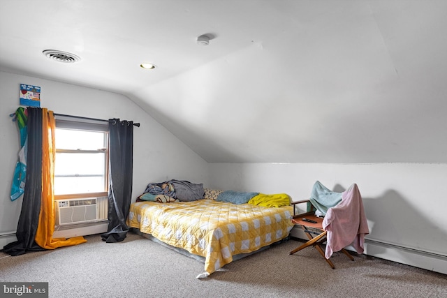 carpeted bedroom featuring lofted ceiling and a baseboard heating unit