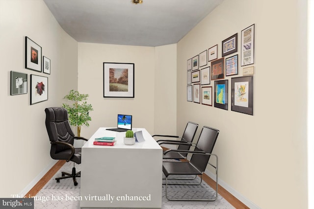 office with light hardwood / wood-style flooring