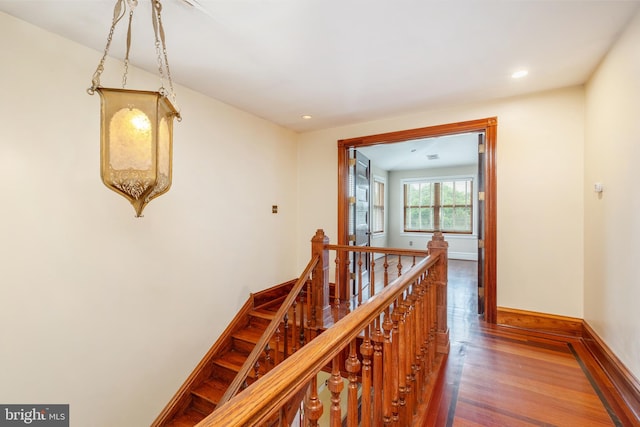 stairway featuring dark hardwood / wood-style flooring