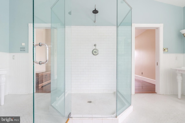 bathroom with an enclosed shower and hardwood / wood-style flooring