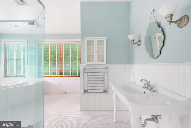 bathroom with a bath to relax in