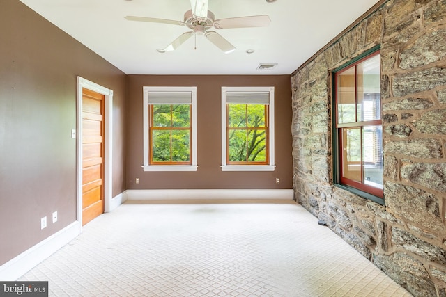 carpeted empty room with ceiling fan