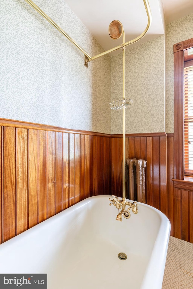 bathroom with wood walls