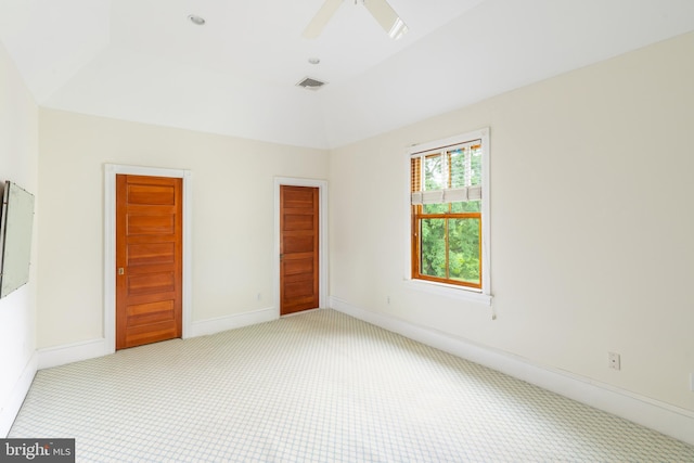 empty room featuring light carpet and ceiling fan