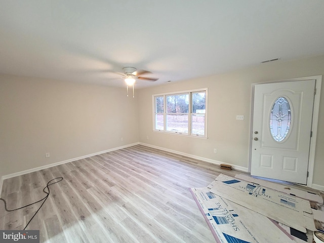 foyer entrance featuring light hardwood / wood-style floors and ceiling fan