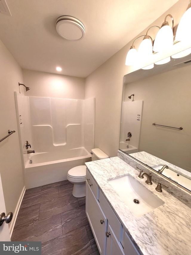 full bathroom with toilet, vanity, and shower / bath combination