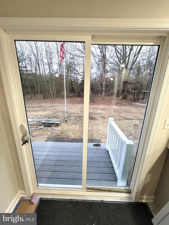 doorway to outside featuring a healthy amount of sunlight