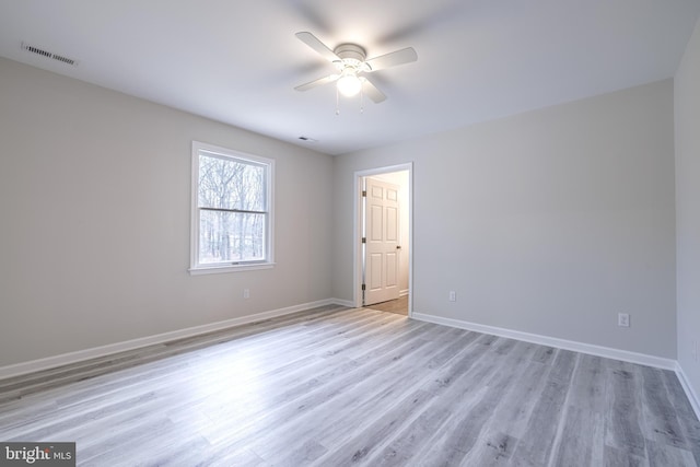 unfurnished room with ceiling fan and light hardwood / wood-style flooring