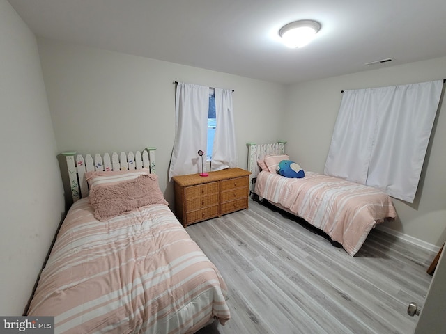 bedroom with light hardwood / wood-style floors