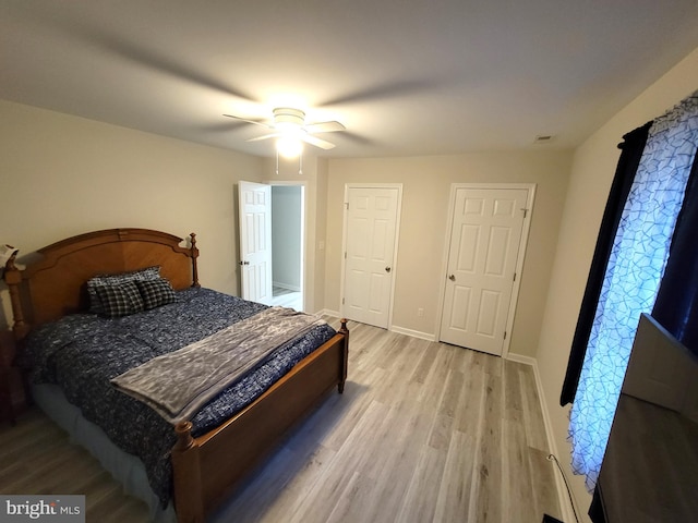 bedroom with light hardwood / wood-style flooring and ceiling fan