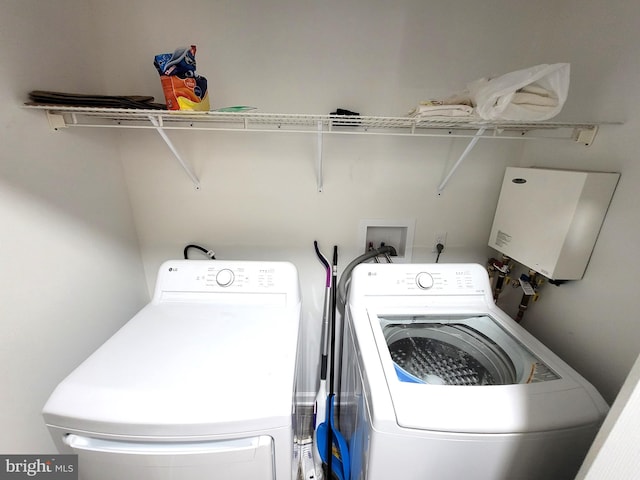 washroom with washing machine and clothes dryer